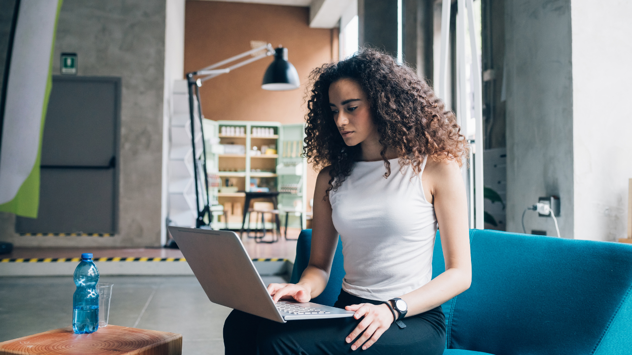 A woman working from an office workspace | Scott Legal, P.C. A woman working from an office workspace