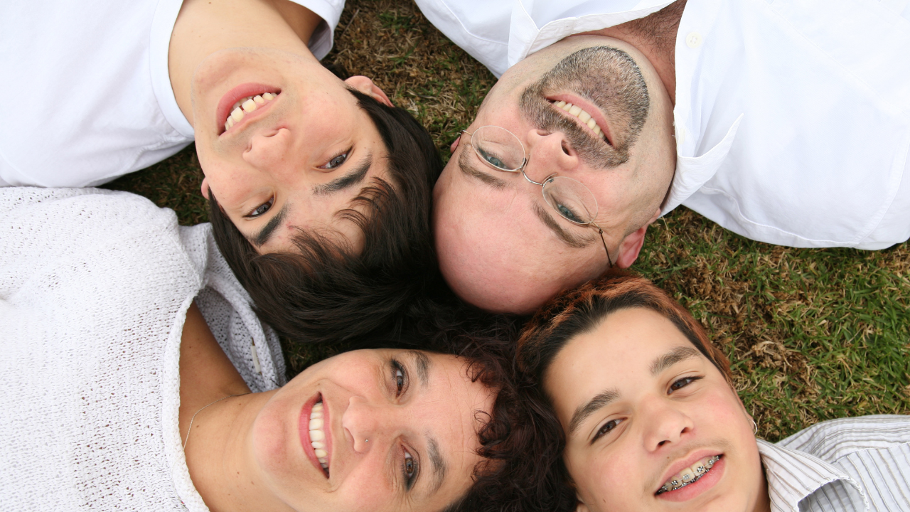 A happy family of four | Scott Legal, P.C. A happy family of four