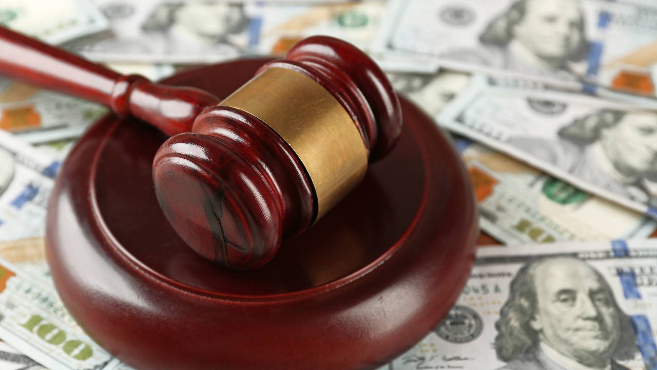 A gavel and money | Scott Legal, P.C. A gavel and money