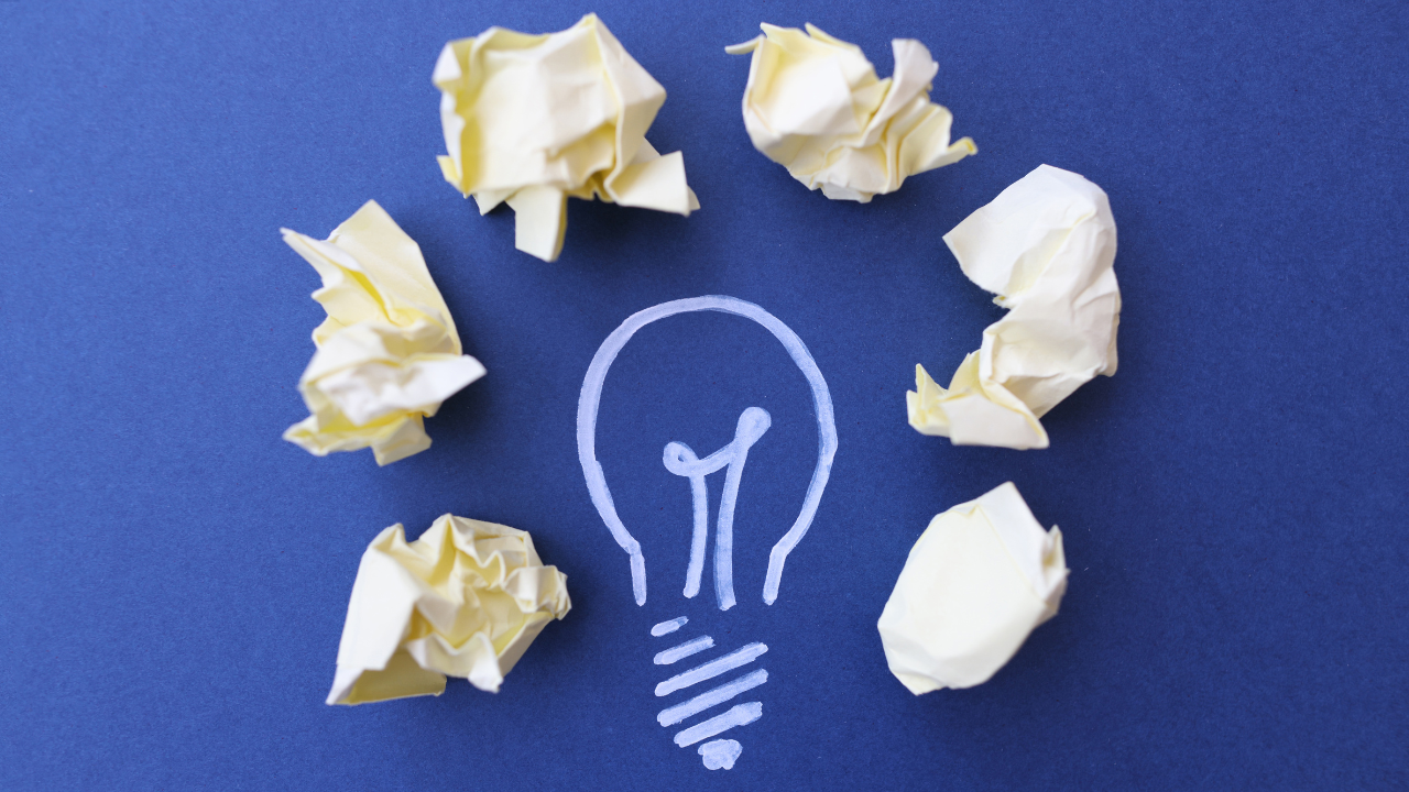 A lightbulb with sticky notes around it | Scott Legal, P.C. A lightbulb with sticky notes around it
