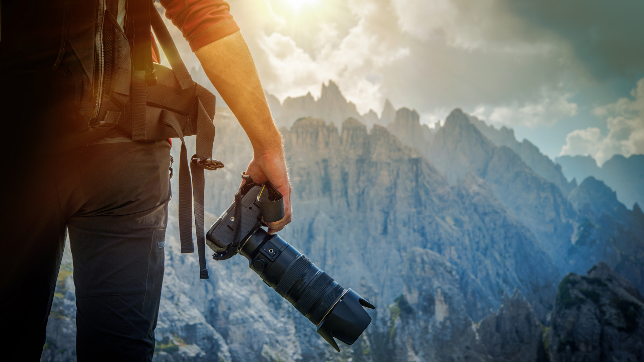 Photographer taking pictures of mountains | Scott Legal, P.C. Photographer taking pictures of mountains