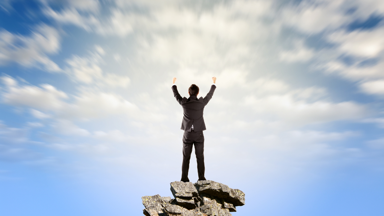 A business professional celebrating a win | Scott Legal, P.C. A business professional celebrating a win
