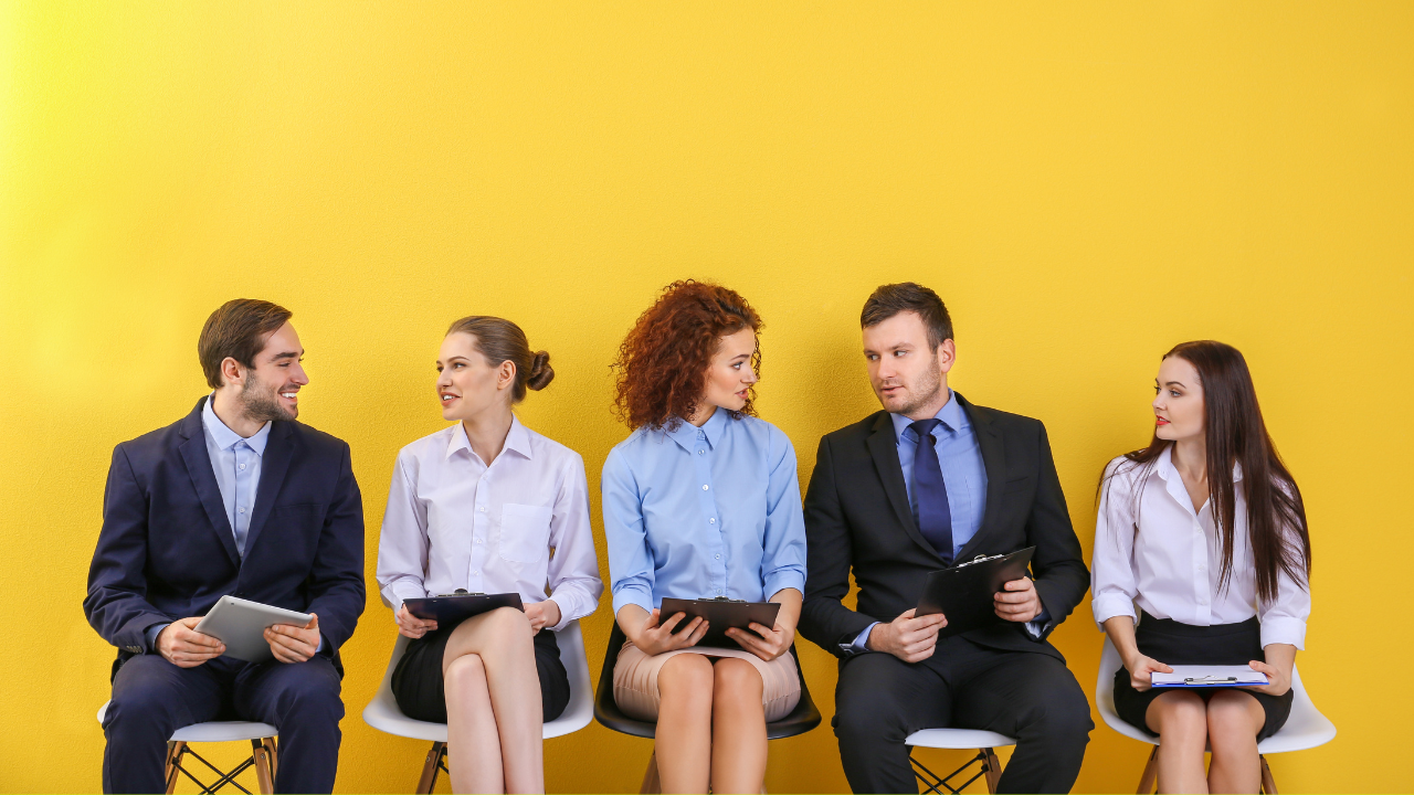 A group of individuals waiting to be interviewed for a job position | Scott Legal, P.C. A group of individuals waiting to be interviewed for a job position