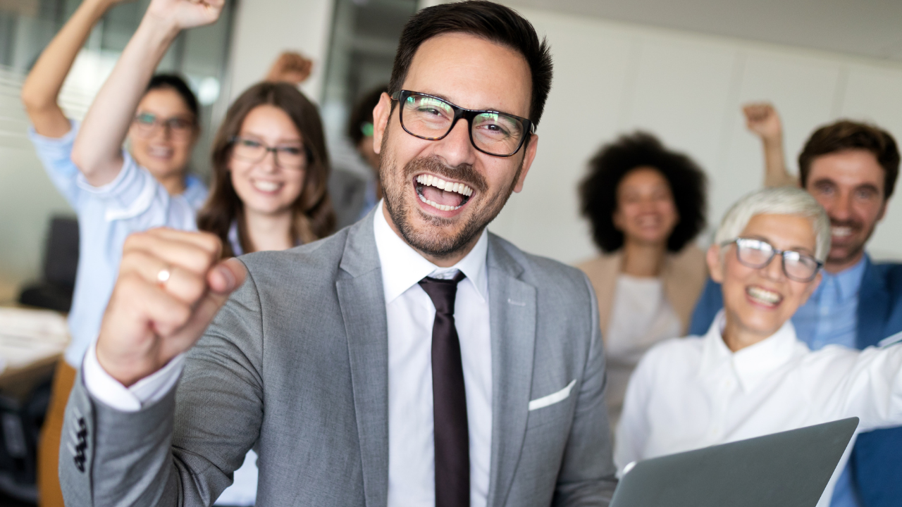 A man celebration success with his team | Scott Legal, P.C. A man celebration success with his team