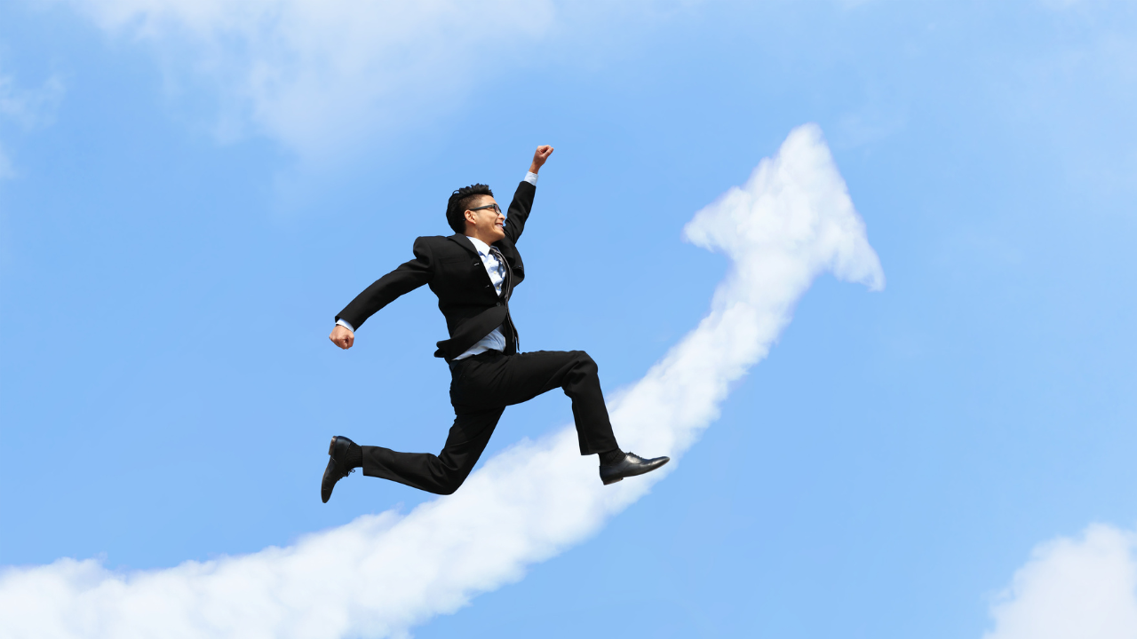 A business professional celebrating a win in an excited leap | Scott Legal, P.C. A business professional celebrating a win in an excited leap