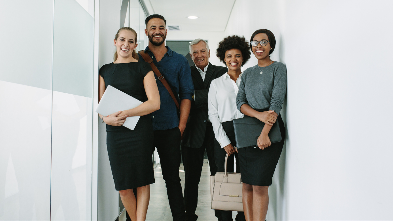 An office team standing in the office | Scott Legal, P.C. An office team standing in the office