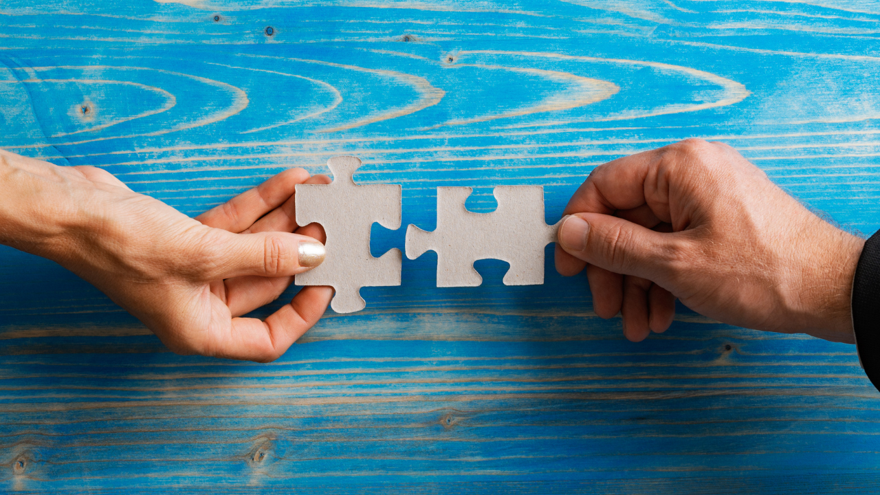 Two connecting puzzle pieces | Scott Legal, P.C. Two connecting puzzle pieces