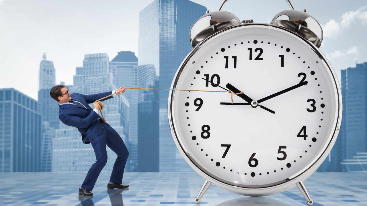 A corporate man pulling a giant clock | Scott Legal, P.C. A corporate man pulling a giant clock