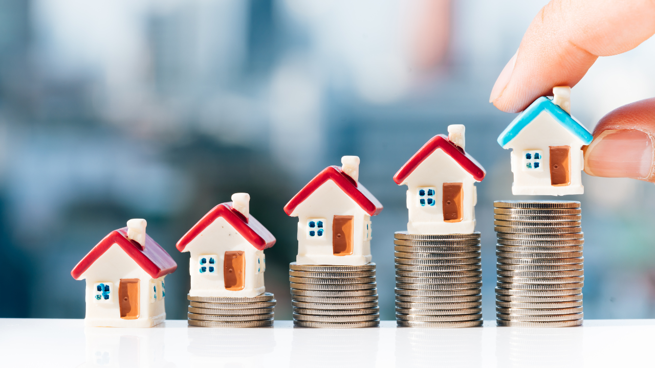 A collection of houses on top of investment in the form of change. | Scott Legal, P.C. A collection of houses on top of investment in the form of change.