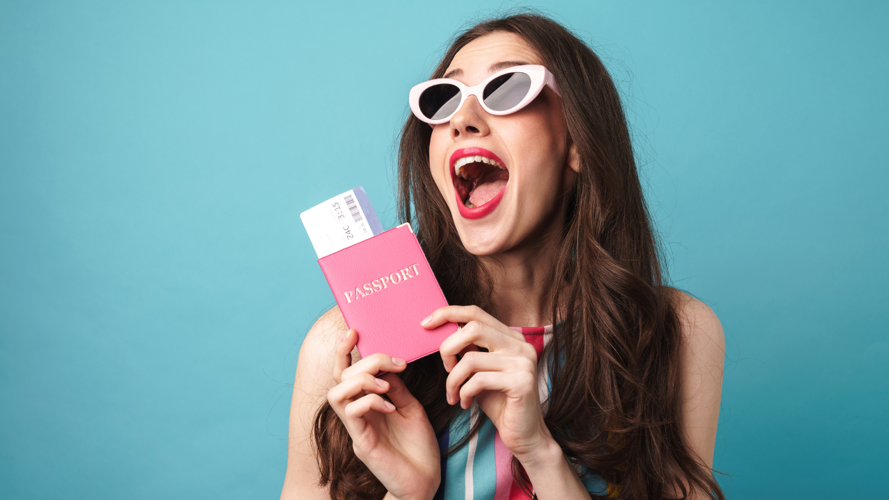A woman holding a passport in excitement | Scott Legal, P.C. A woman holding a passport in excitement