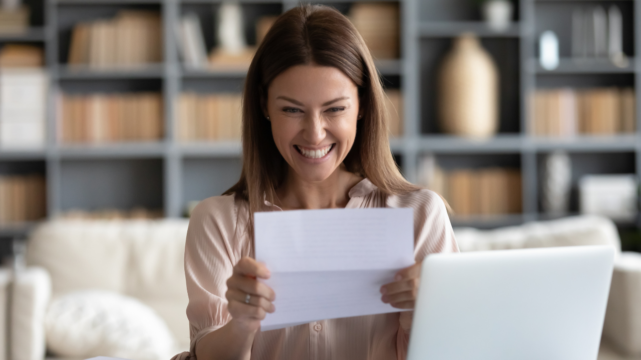 A woman celebrating a win | Scott Legal, P.C. A woman celebrating a win