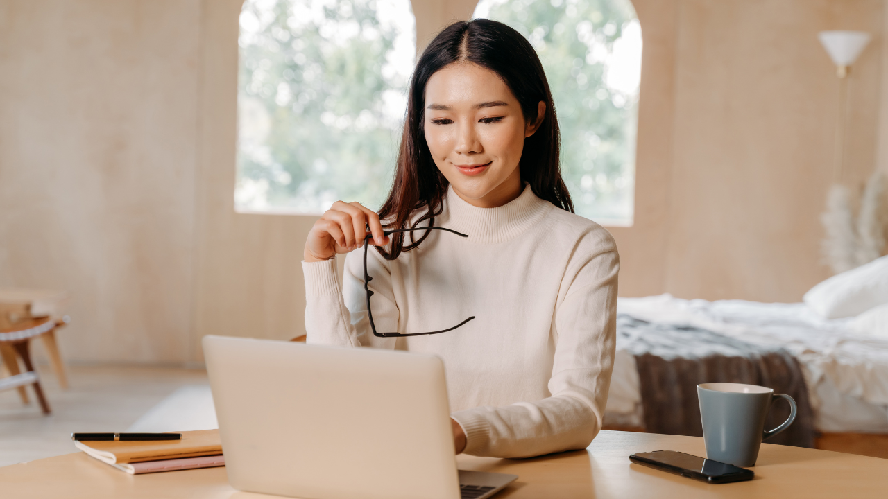 A woman conducting business on a laptop | Scott Legal, P.C. A woman conducting business on a laptop