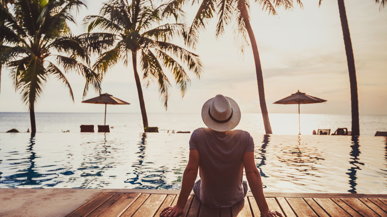 A man sitting in front of a pool | Scott Legal, P.C. A man sitting in front of a pool