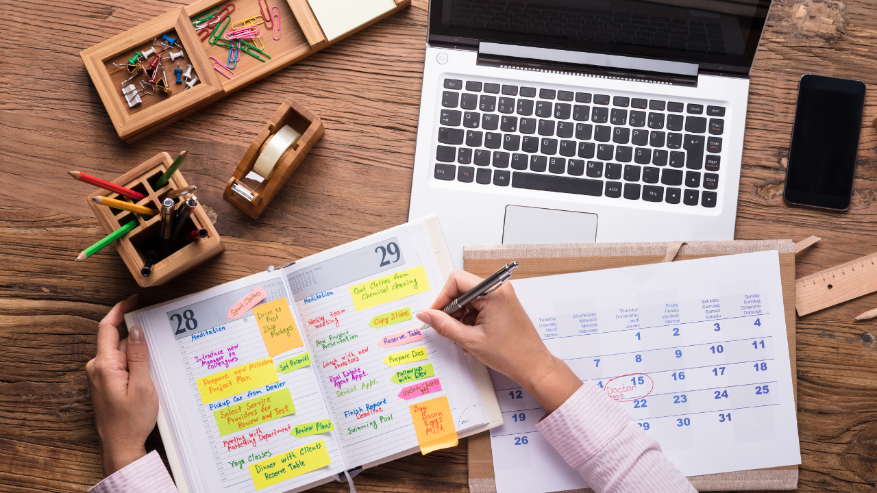 Calendar and schedule and a laptop on a table | Scott Legal, P.C. Calendar and schedule and a laptop on a table