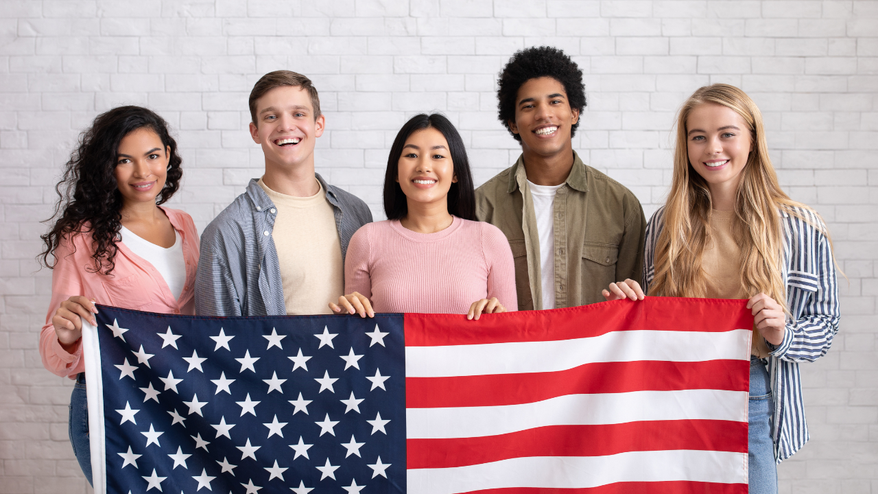 A group of people holding the US flag | Scott Legal, P.C. A group of people holding the US flag