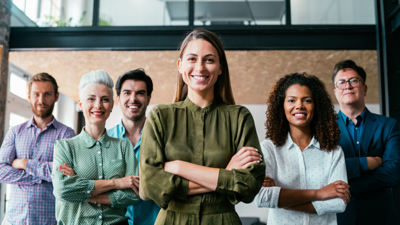 A team of business executives standing together in unison | Scott Legal, P.C. A team of business executives standing together in unison