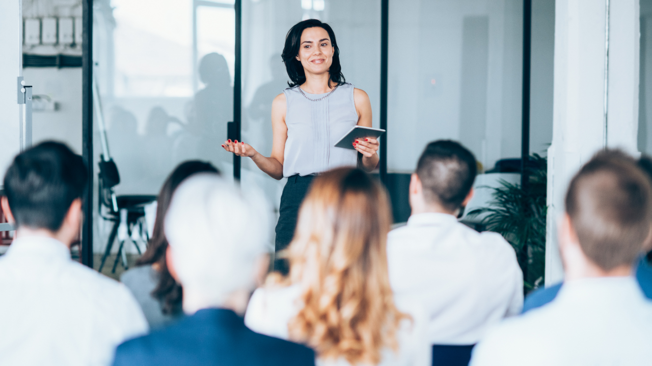 A corporate worker teaching a seminar | Scott Legal, P.C. A corporate worker teaching a seminar