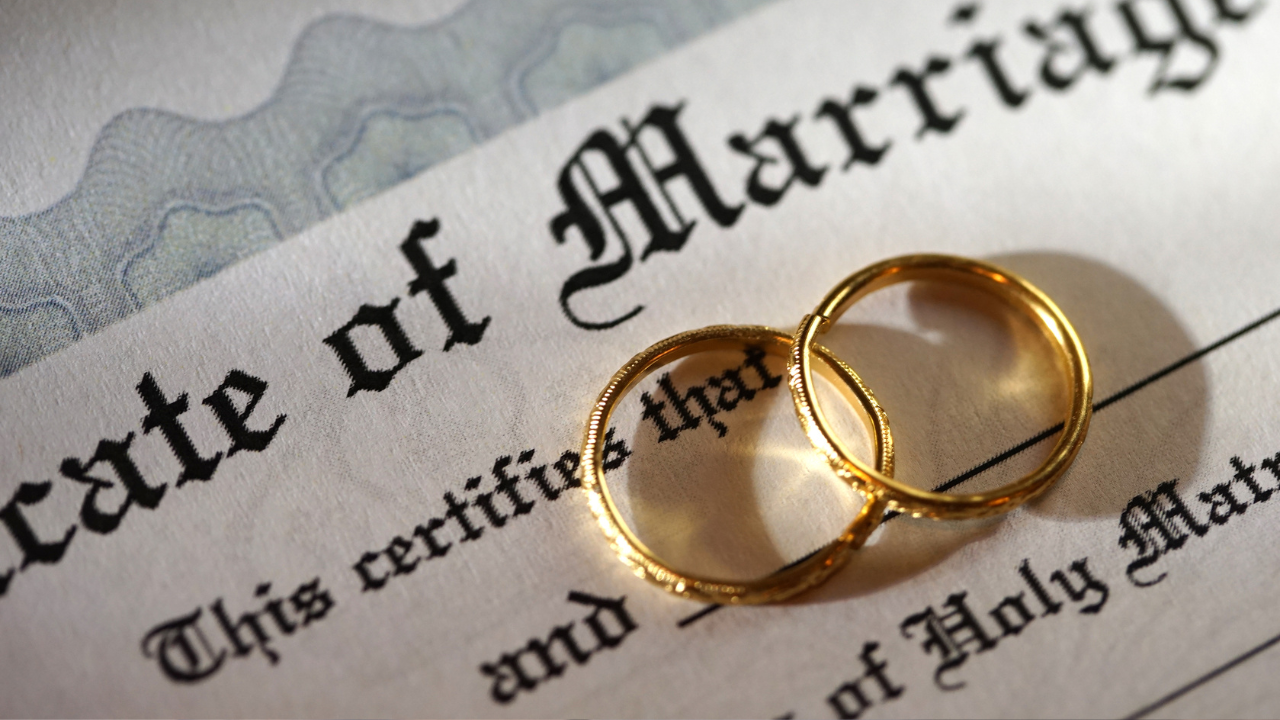 Marriage certificate and rings | Scott Legal, P.C. Marriage certificate and rings