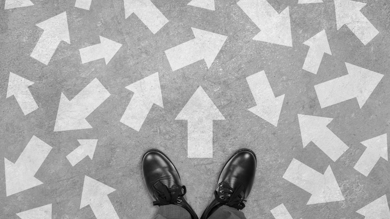 Feet and arrows on the ground as a symbol of potential options | Scott Legal, P.C. Feet and arrows on the ground as a symbol of potential options