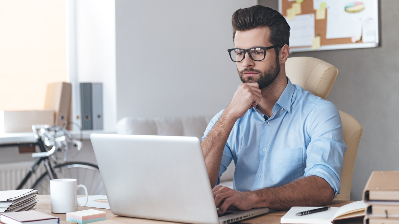 Corporate worker working from a laptop | Scott Legal, P.C. Corporate worker working from a laptop