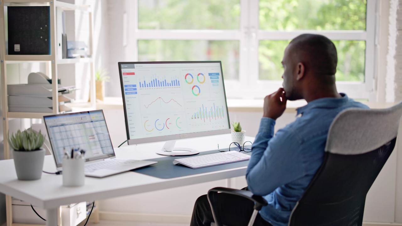 A business professional consulting charts on his computer | Scott Legal, P.C. A business professional consulting charts on his computer
